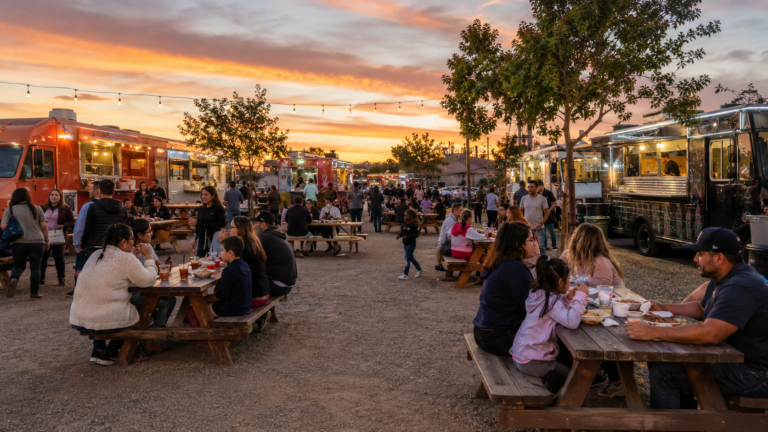 Busy Modesto food truck park with outdoor dining and local street food